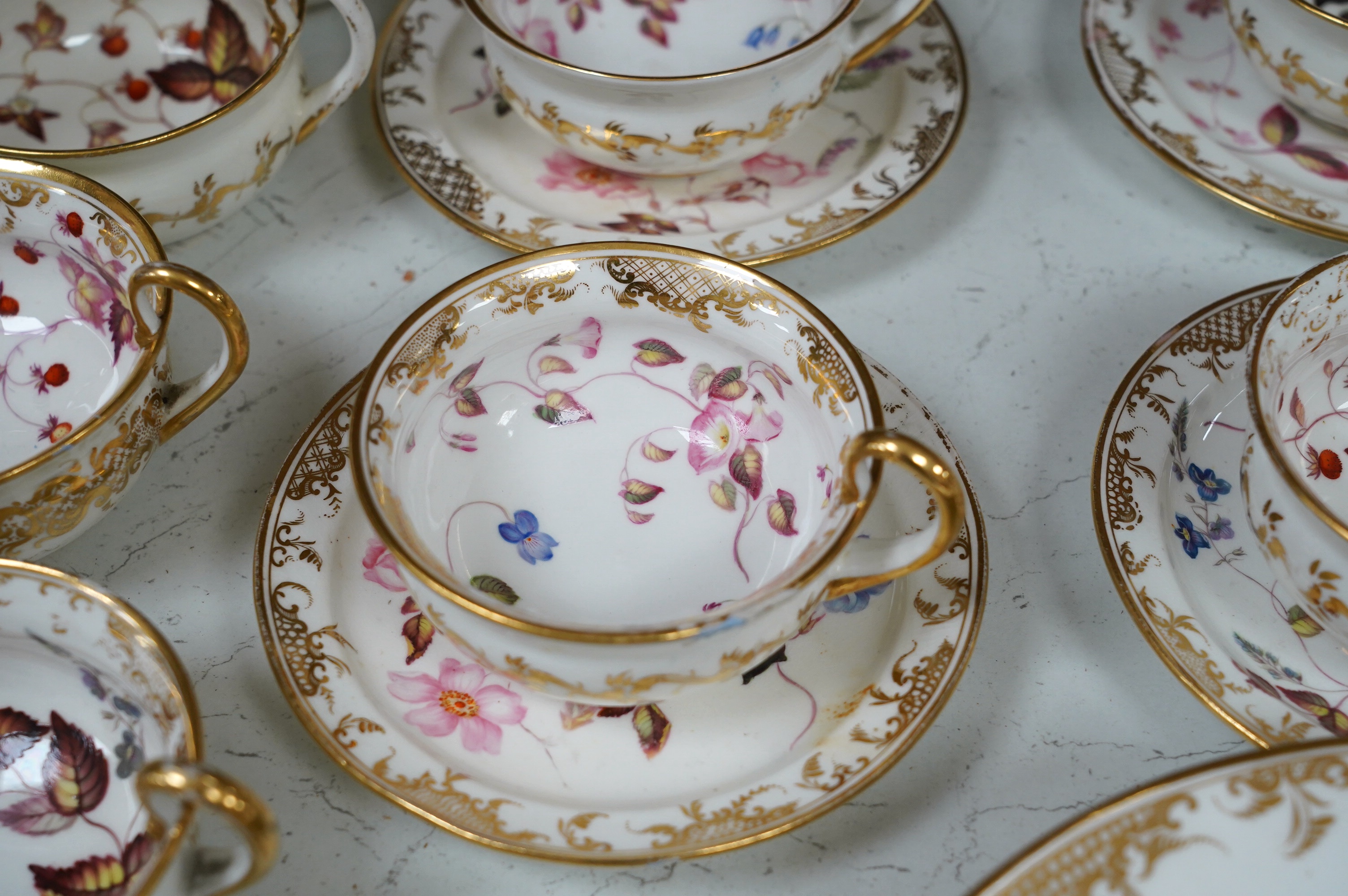 A floral part tea and coffee set, probably Swansea, c.1815-20, largest 23.5cm diameter. Condition - mostly fair